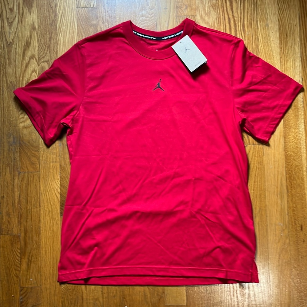 Air Jordan red tee shirt with jordan emblem on front. Brand new